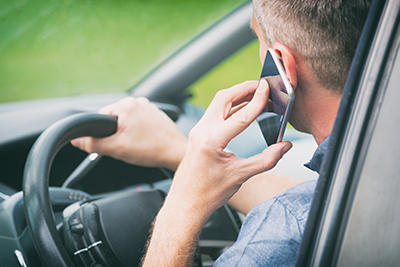 Man in car on cell phone