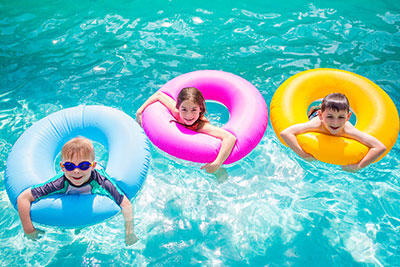 Kids floating in a pool