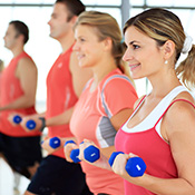 aerobic class with weights at gym